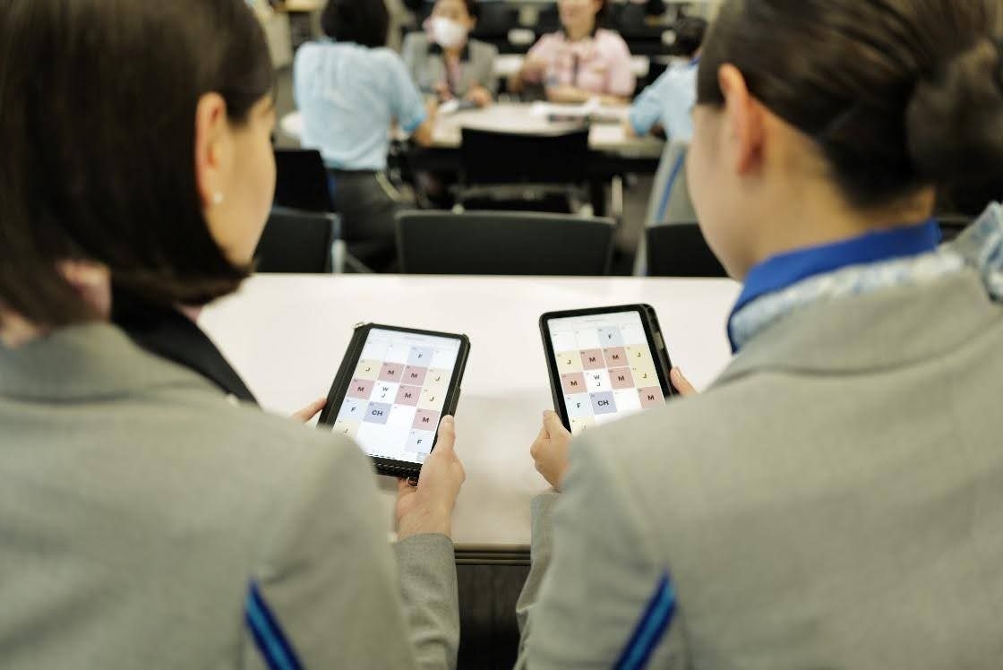two ANA flight attendants using their new Ditto mobile application