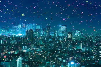 City skyline at night with twinkling lights